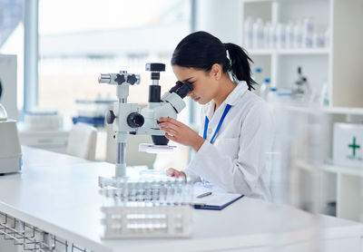 Doctor examining chemical in laboratory