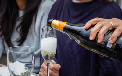 Female friends enjoying a drink of champagne