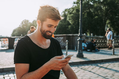 Young man using mobile phone