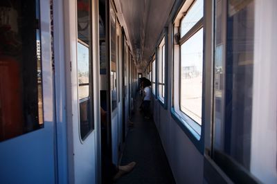 Rear view of people in train