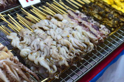 High angle view of meat on barbecue