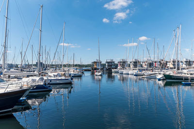 Boats moored at harbor