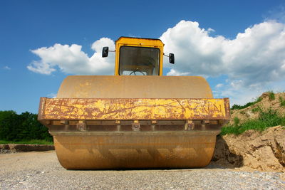 Steamroller against sky