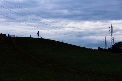 Scenic view of field against sky at dusk