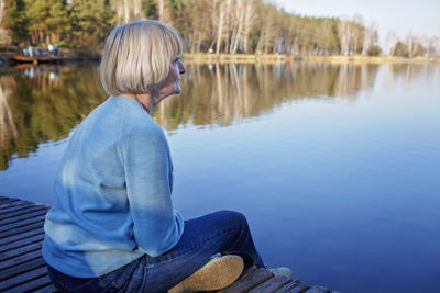 Rear view of woman looking at lake