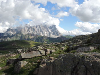 Scenic view of mountains against cloudy sky