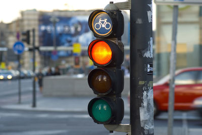 Close-up of road sign on street in city