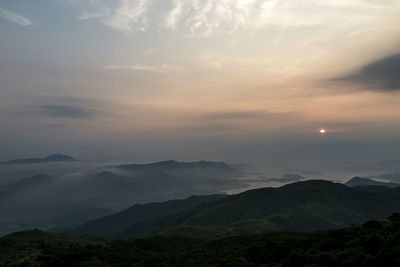 Scenic view of mountains against sky during sunset