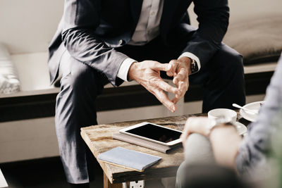 Businessman consulting customer in cafe