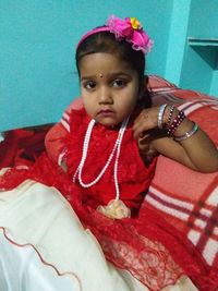 Portrait of cute girl with pink flower