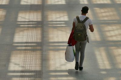 Rear view of man walking outdoors