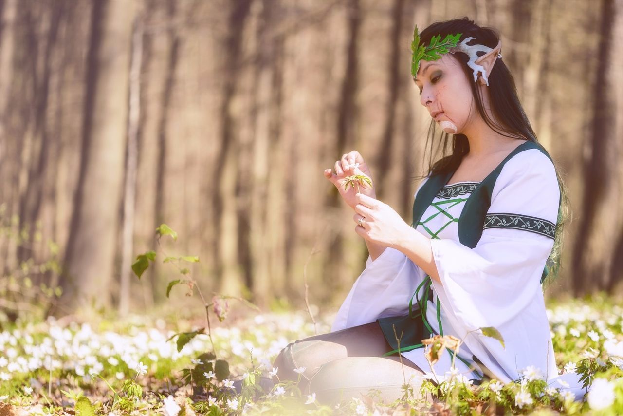 young adult, only women, flower, adult, beauty, one woman only, adults only, one young woman only, outdoors, sunlight, sitting, one person, old-fashioned, women, people, wreath, nature, beautiful woman, young women, day, flower head