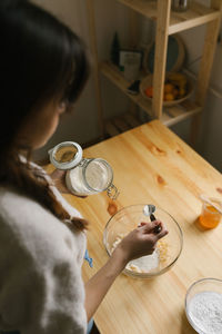 Young woman making christmas cookies