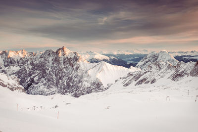 Scenic view of snowcapped mountains against sky