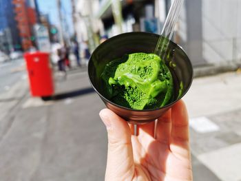 Midsection of person holding glass bowl