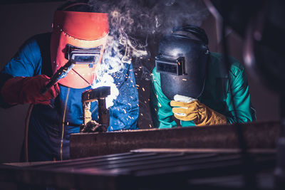 Man working on metal grate