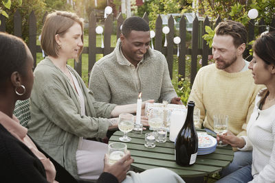 Happy friends having party in garden