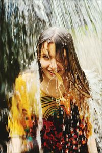 Close-up of young woman in water