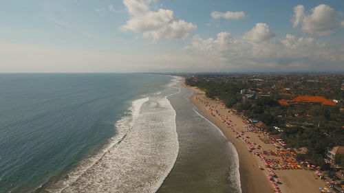 Aerial view of beautiful beach, hotels and tourists, bali, kuta. beautiful view nice tropical beach 