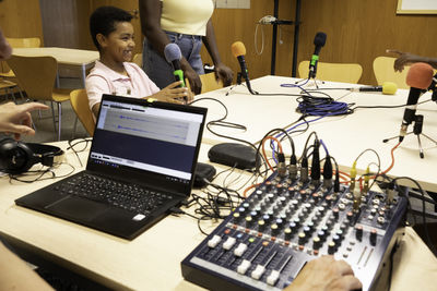 High angle view of woman using laptop on table