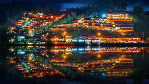 High angle view of illuminated buildings in city at night