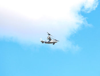 Low angle view of airplane flying in sky