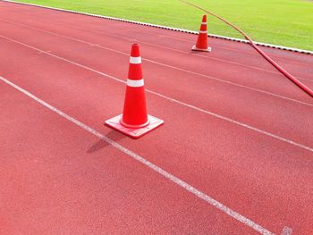 Red traffic cones on running track