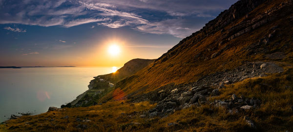 Scenic view of sea against sky during sunset