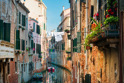 View of buildings by canal in city