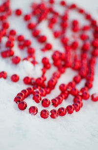 Close-up of red bed necklace