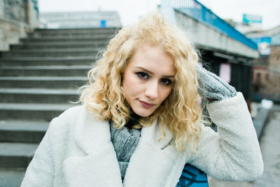 Portrait of smiling young woman standing outdoors