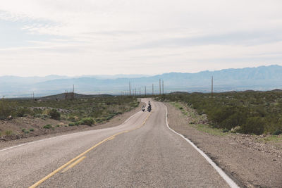 Road amidst landscape against sky