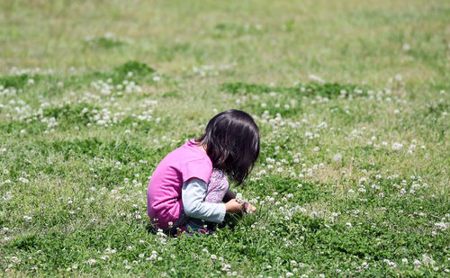 Girl sitting on field