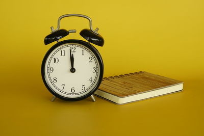 Close-up of clock on table