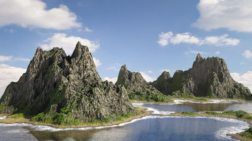 Scenic view of sea and mountains against sky