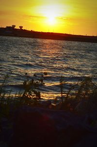 Scenic view of sea at sunset