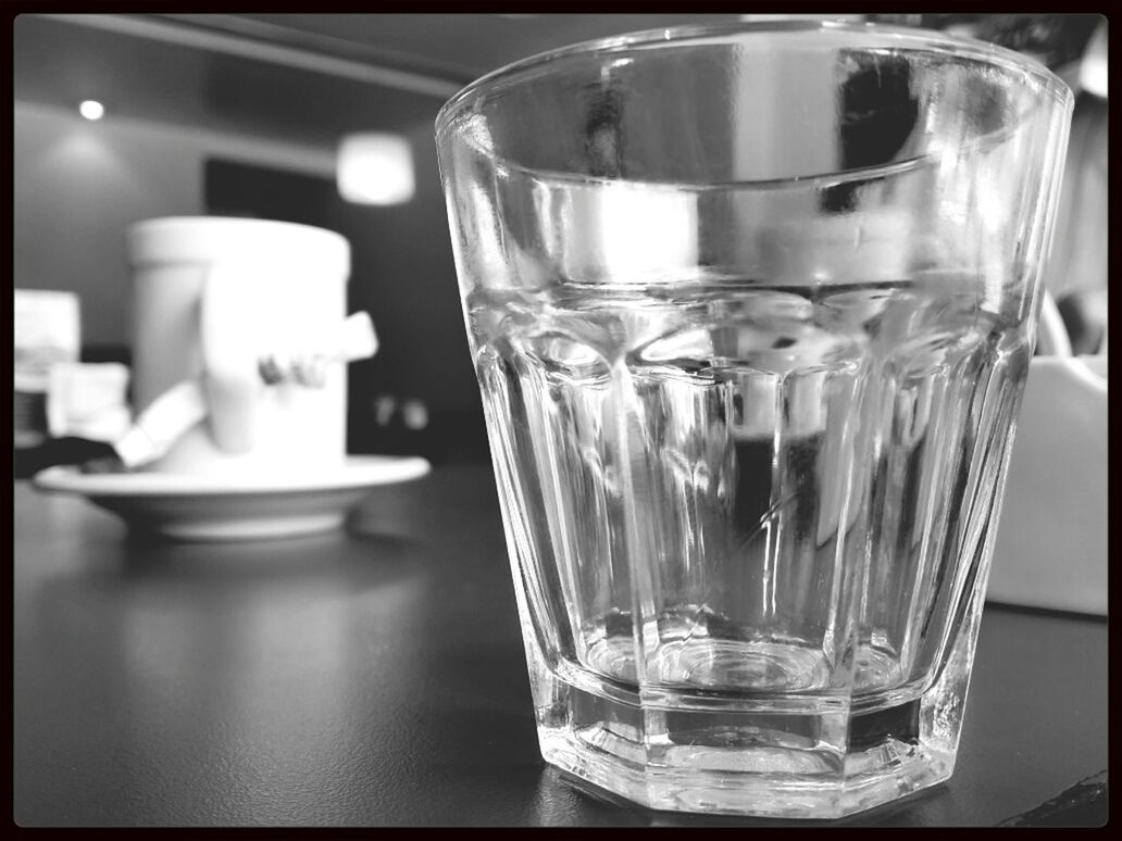 CLOSE-UP OF GLASSES ON TABLE