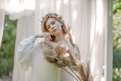 Portrait of young woman outdoors