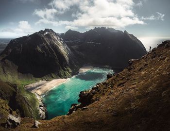 Panoramic view of sea and mountains against sky