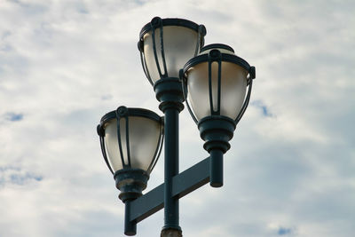 Low angle view of street light against sky