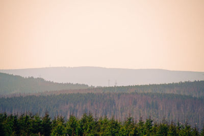 Scenic view of landscape against clear sky during sunset