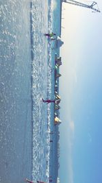 People on beach against sky