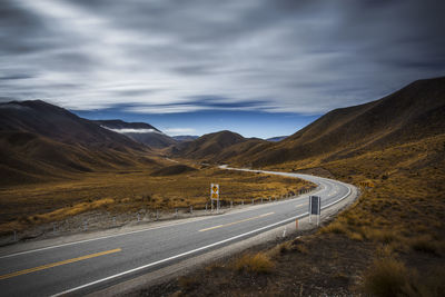 Scenic view of mountain road against sky