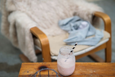 Pink smoothie on the wooden cozy table