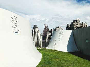 Panoramic view of buildings in city against sky