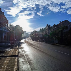 Street amidst buildings against sky