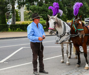 Full length of man standing on road