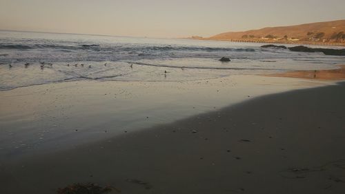 Scenic view of sea against sky at sunset