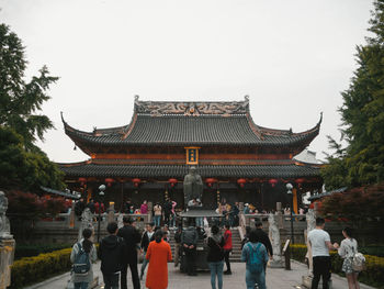 Group of people in temple against building