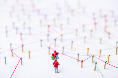 Close-up of figurines on white background